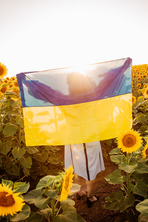 Woman expressing patriotism through flagの写真素材