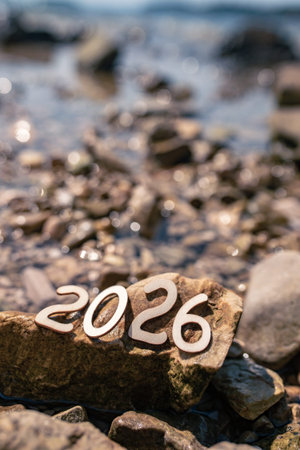 Rocks by the water showing the year 2026 clearly