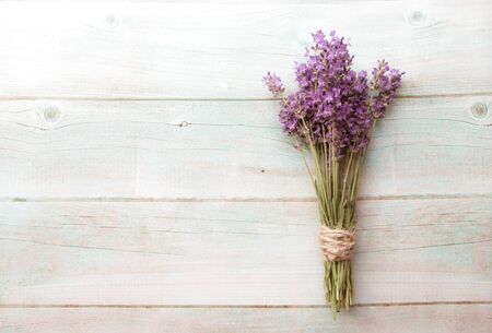 Vintage background of Composition of lavender on white wood. Fresh summer flowers. Free space. Top viewの写真素材