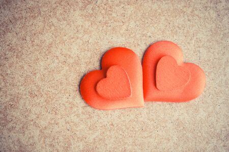 Two Red hearts on the wooden desk background. Copyspaceの写真素材
