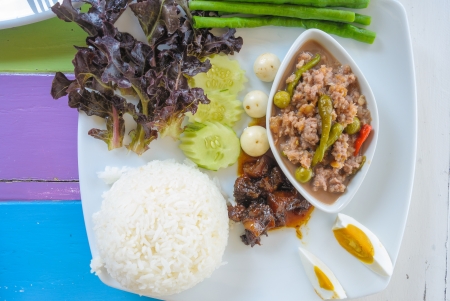 sweet pork with chili sauce and fresh vegetable rice setの写真素材