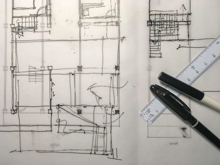 freehand black ink sketch drawing of building structure on tracing paper with pen and scale top view
