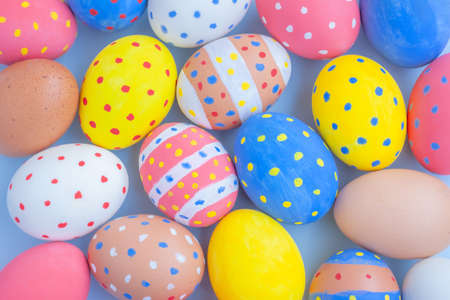 Colorful easter eggs on blue backgroundの写真素材