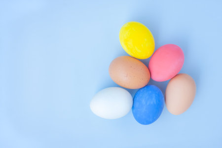 Colorful eggs on blue background