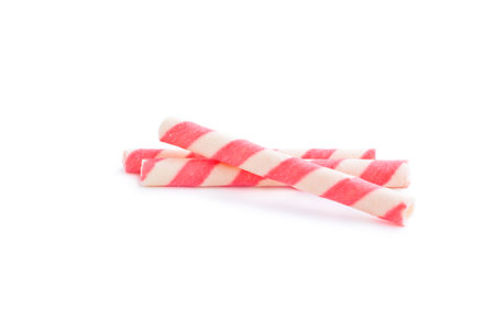 Striped wafer rolls isolated on white background. Top view.の写真素材