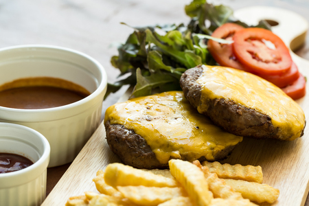 Beef burger with potato chips and vegetable.の写真素材