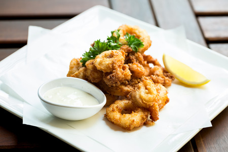 Fried Calamari ring  go with sauce.の写真素材