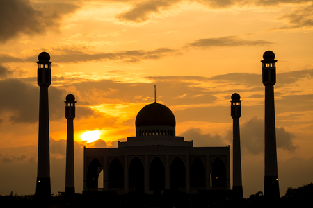Evening light behind silhouette of central mosque located in Hadyai, Thailand.の写真素材