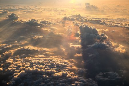 Cloudscape view at dawn from airplane window.の写真素材
