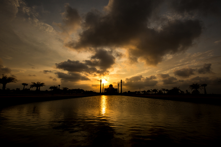 Evening light behind silhouette of central mosque located in Hadyai, Thailand.の写真素材