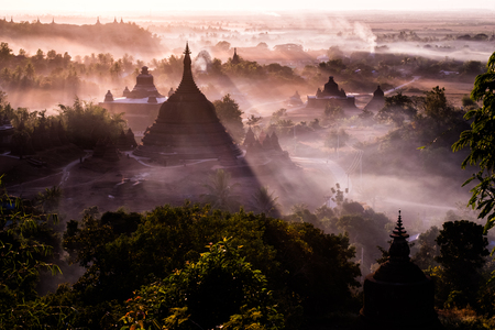 During sunset over pagoda in Mrauk-u, Myanmar.の写真素材