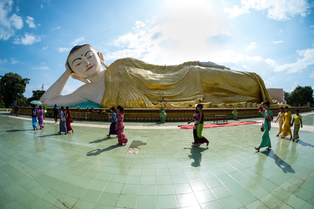 Bago, Myanmar - November 5, 2016: People walking around reclining Buddha name Naung Daw Gyi Mya Tha Lyaung.のeditorial素材