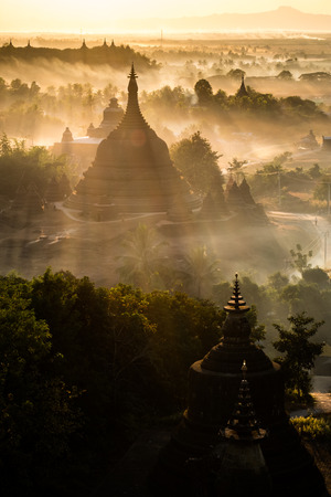 During sunset over pagoda in Mrauk-u, Myanmar.の写真素材