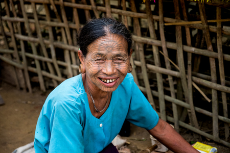 Kyi Chaung, Mrauk U, Rakhine state, Myanmar - Jan 3, 2017: An old Chin woman with tattooed face in Chin village.のeditorial素材