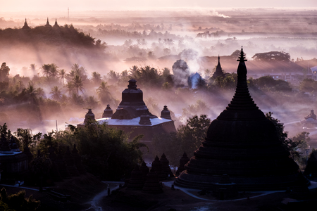 During sunset over pagoda in Mrauk-u, Myanmar.の写真素材