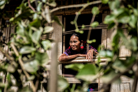 Kyi Chaung, Mrauk U, Rakhine, Myanmar - Jan 3, 2017: An old Chin woman with tattooed face in Chin village.のeditorial素材
