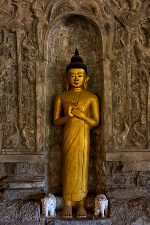 Buddha image in low light at Andaw Thein temple.の写真素材