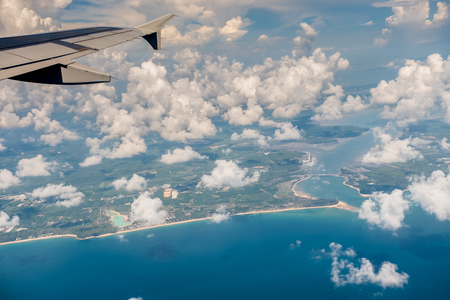 Top view of seascape island from airplane window.の写真素材