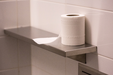 bathroom tissue on stainless shelfの写真素材