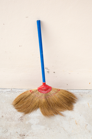 broom and coconut palms grass for recycle bin and cleansing day, on the wall witch's broomstick,の写真素材