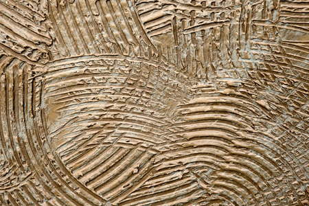 Abstract brown cement pattern on wall background and textureの写真素材