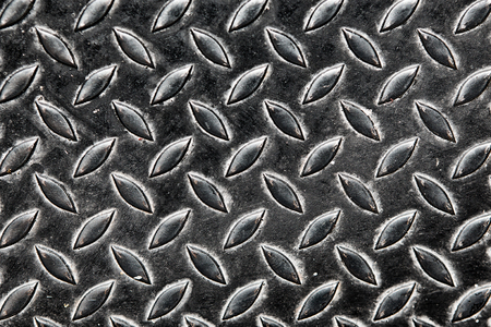 Old rusty diamond metal plate texture pattern used as abstract backgroundの写真素材