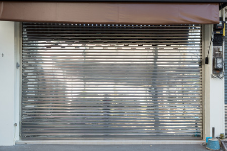 background of grunge stainless steel roller shutter doorの写真素材