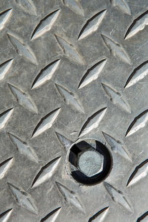 Metal diamond plate pattern and background seamless, grunge diamond metal plate with screwの写真素材