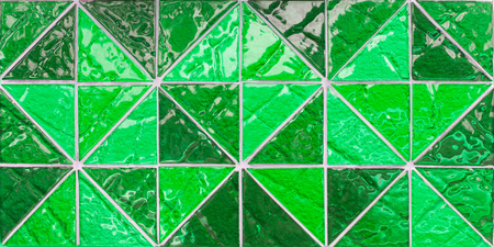 abstract green triangle pixel mosaic wall background and textureの写真素材