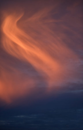 Beautiful stormy sunset sky. Cloudy abstract background. Sunset colors.