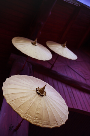Ancient umbrella in the Thai templeの写真素材