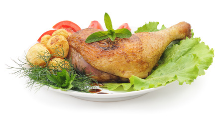 Chicken thigh with vegetables on a platter.の写真素材