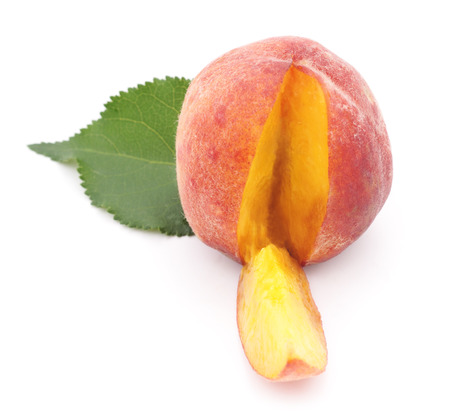 Cut peach isolated on a white background.の写真素材