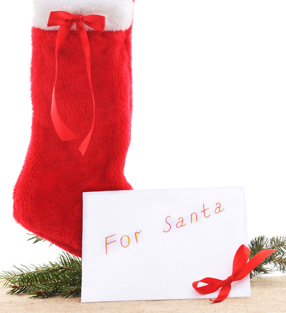 Christmas boots with a letter to Santa on a white background.の写真素材