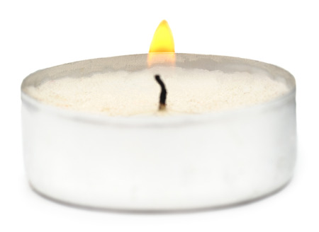 Burning candle isolated on a white background.の写真素材
