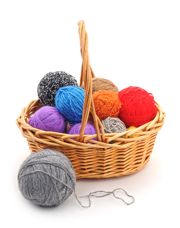 Basket with colored balls on a white background.の写真素材