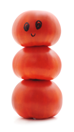 Man of tomatoes in a hat is isolated on a white background.の写真素材