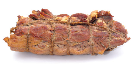 One big piece of smoked meat isolated on a white background.の写真素材