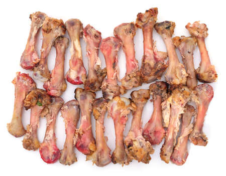 Pile of chicken bones isolated on a white background.の写真素材