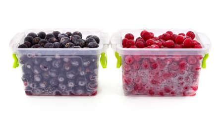 Frozen berries in containers isolated on a white background.の写真素材