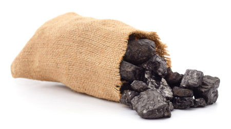 Coal in a bag isolated on a white background.の写真素材