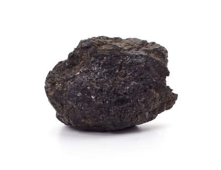 One black charcoal isolated on a white background.