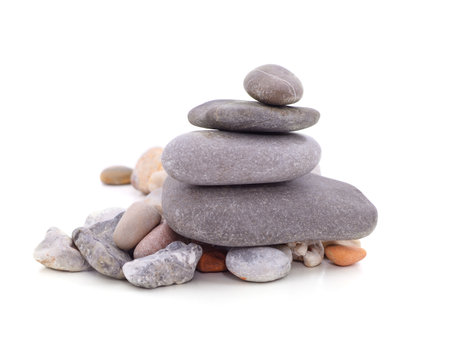 A pile of different stones isolated on a white background.の写真素材