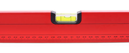 Red construction level isolated on white background.