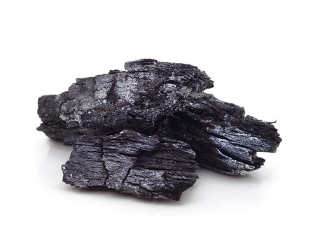 Pile of charcoal isolated on a white background.の写真素材