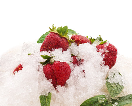Strawberries and ice are isolated on a white background.の写真素材