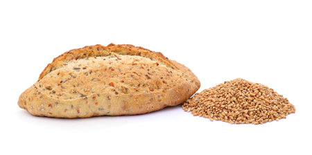 Bread and a pile of wheat isolated on a white background.の写真素材