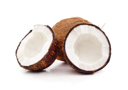 Fresh coconut halves isolated on a white background.の写真素材