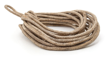 Coiled old rope isolated on white background.の写真素材