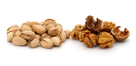 Nuts and pistachios isolated on a white background.の写真素材
